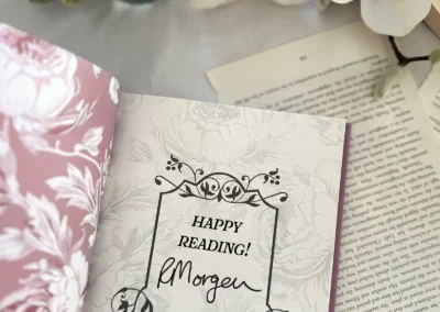Love & Letter Charms hardback special edition with the authors signature printed within a decorative frame on the front page inside the book.